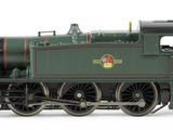a green train that is on the tracks on a white background
