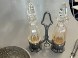 two salt and pepper shakers and a bowl on the table