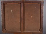 an old wooden easel with a piece of wood on top of it