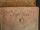 an old book with writing on it sitting on a table