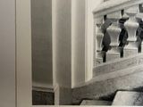 a black and white photo of a staircase in a building
