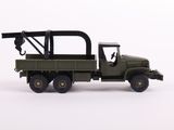 a toy army truck with a crane on the back of it