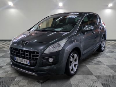 a picture of a grey car parked in a garage