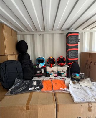 many boxes and bags in the back of a moving truck