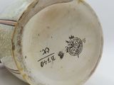 a close up of a vase with a design on it