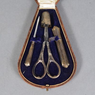 a case with a pair of scissors and a knife in it