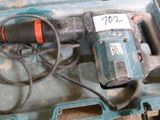 a blue tool box with a drill and a cord in it