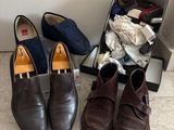 two pairs of shoes sitting next to each other on the floor