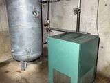 a tank and a water heater in a room