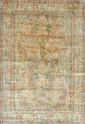 an antique persian rug with a floral design on a beige ground