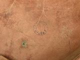 a close up of a piece of leather with a stamp on it