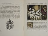 an open book with a picture of a woman laying on a bed
