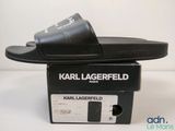 black karl lagerfeld slides on top of a black box