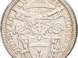 a close up of a coin with a coat of arms on it