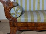 a couch that is sitting on a tile floor