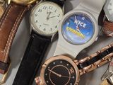 a lot of watches that are sitting on a table