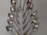 a lot of spoons arranged in a circle on the table