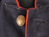 a close up of a military jacket with buttons on it