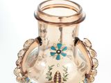 a glass vase with a floral design on it
