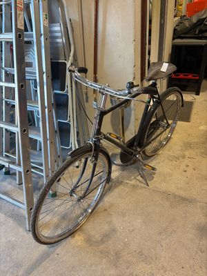 a bike that is leaning against a rack in a garage