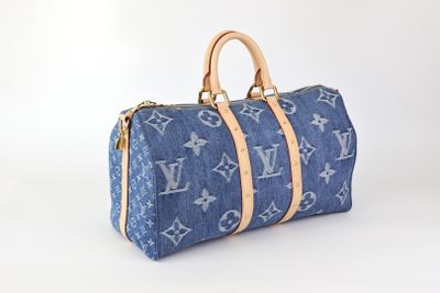 Sac Louis Vuitton en denim bleu avec des anses en cuir beige