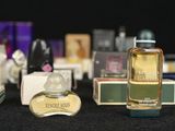 a lot of perfume bottles that are sitting on a table