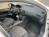 the interior of a car with the door open showing the steering wheel and dashboard