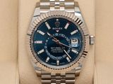 the rolex watch is in a box with a watch in it