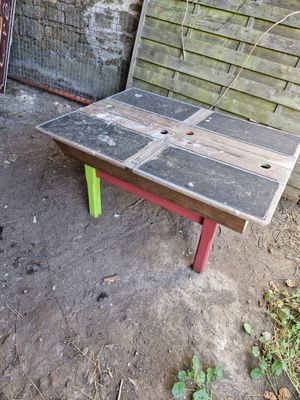 a bench made out of wood and a table made out of old boards