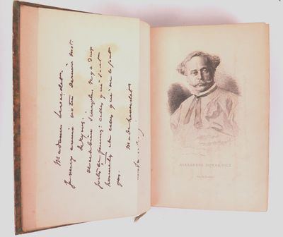 an open book with a drawing of a man in a hat on it