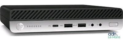 the front of a silver and black hp desktop computer on a white surface