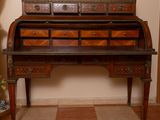 a wooden desk with drawers on it in a room