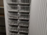 an image of a refrigerator with baskets inside of it