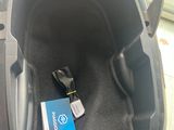 a box in the trunk of a car with a remote in it
