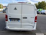 a white van that is parked in a parking lot