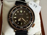a watch in a box with a price tag on it