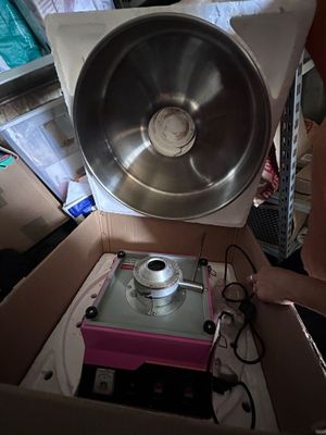 a woman that is standing in a box with a bowl