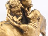 a statue of a man riding a horse with a child on his back