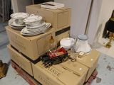 a stack of boxes with plates and cups on top of them