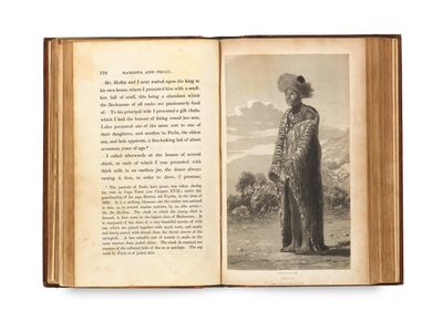 an open book with a picture of a man in a hat and coat