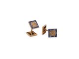 two gold cufflinks with blue and white diamonds on them