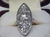 an image of a diamond ring is displayed in a ring holder