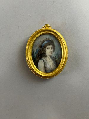 miniature portrait of a woman in a blue hat in a gold frame
