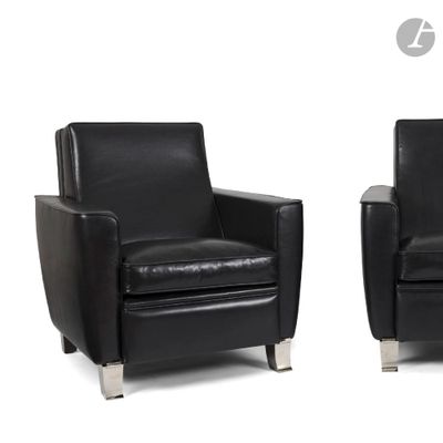 pair of black leather chairs with chrome legs on a white background