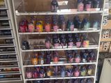 a display case with many different types of drinks in it