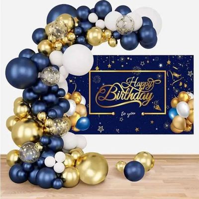 a blue and gold balloon arch with balloons and a happy birthday sign