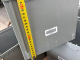 a large box with a measuring tape on top of it
