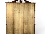 an image of a wooden cabinet with a mirror on top of it