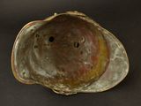 a shell with a hole in it on a black surface