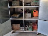 a metal cabinet with a bunch of items inside of it